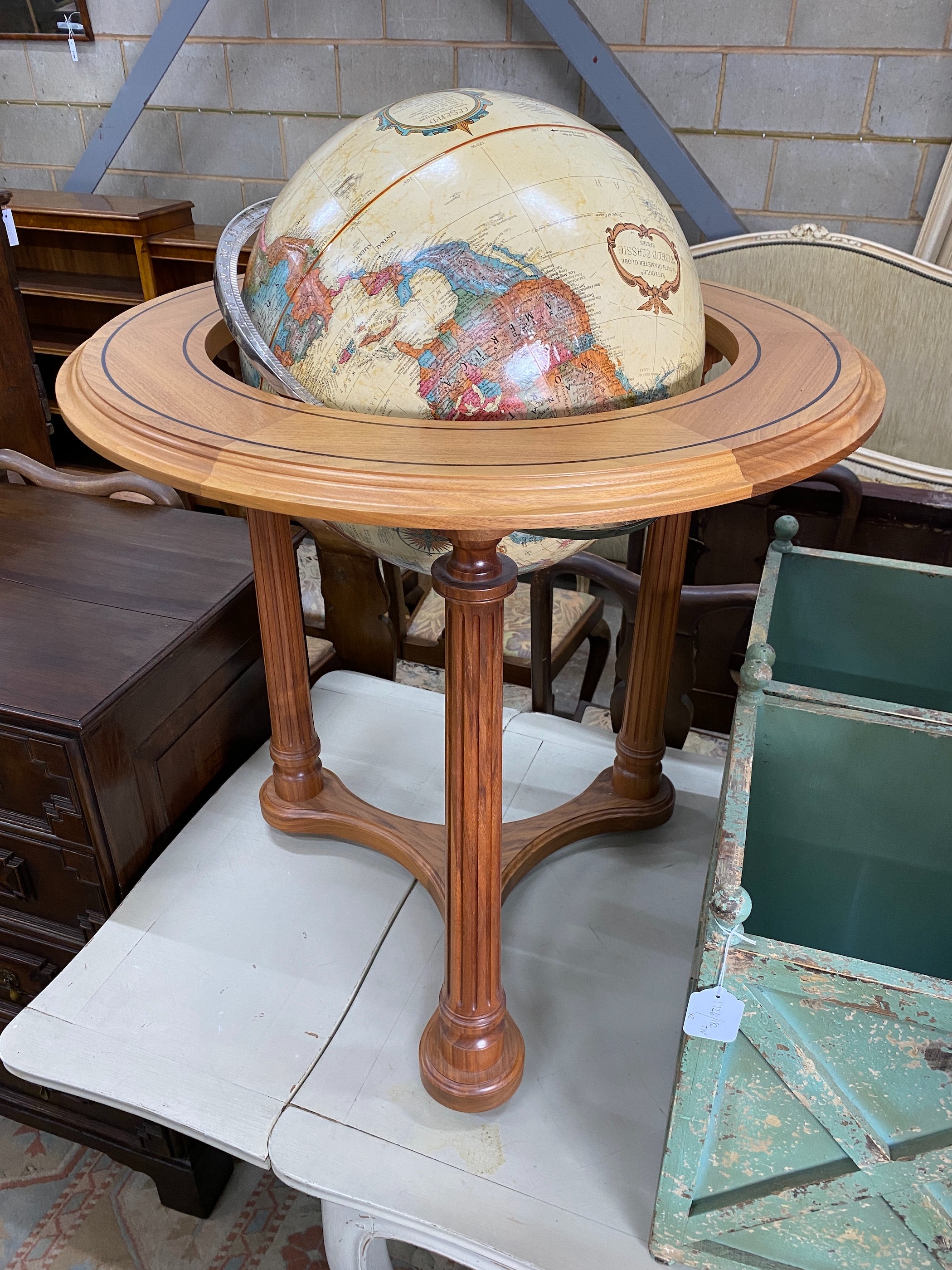 A Repogle World Classic Series globe of the world, 25in. diameter, raised on a mahogany stand, by David Linley, height 90cm